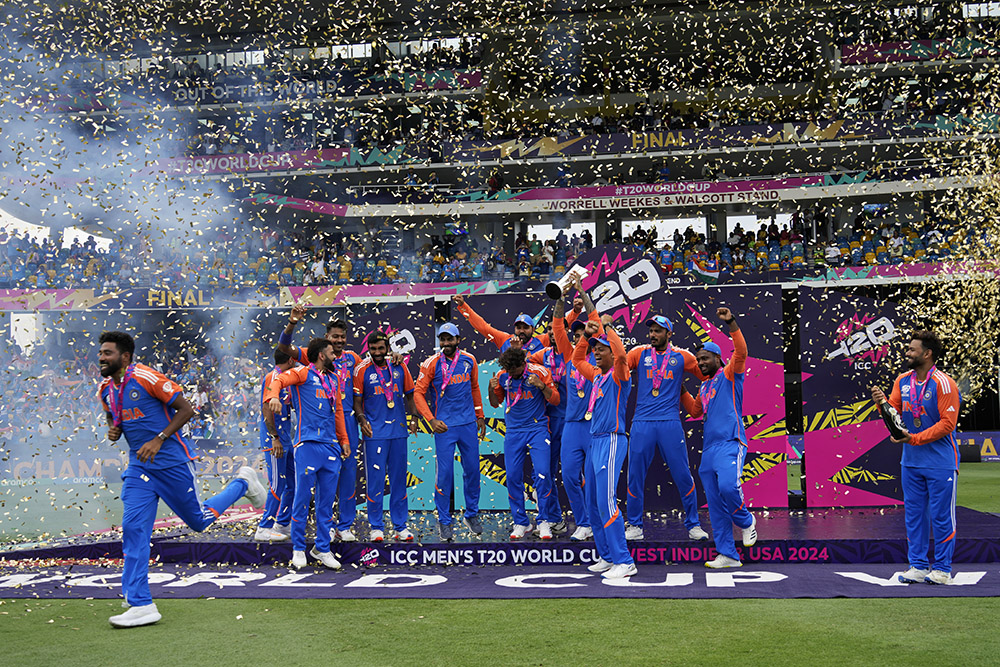 Indias players celebrate with the winners trophy 